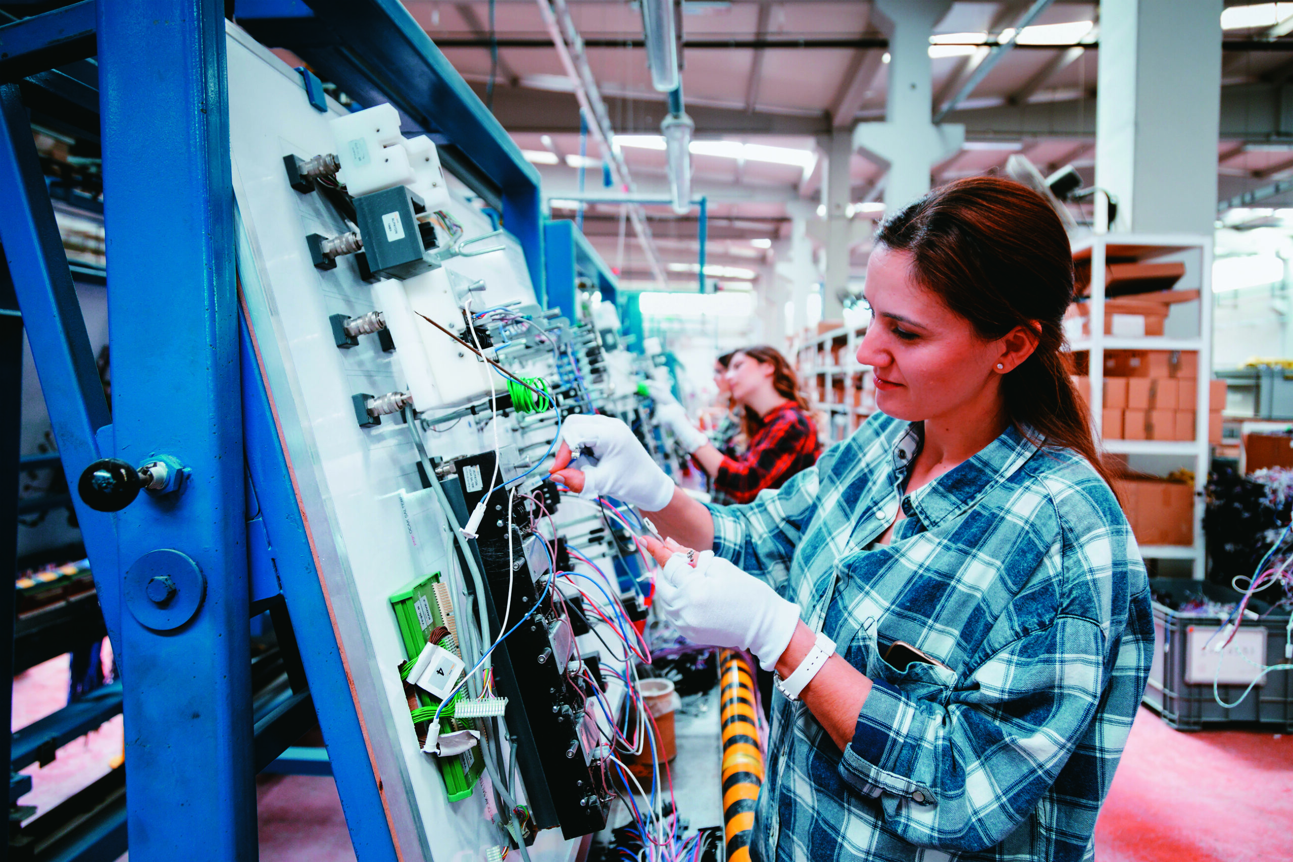 Female manuel workers team working on the production line in factory